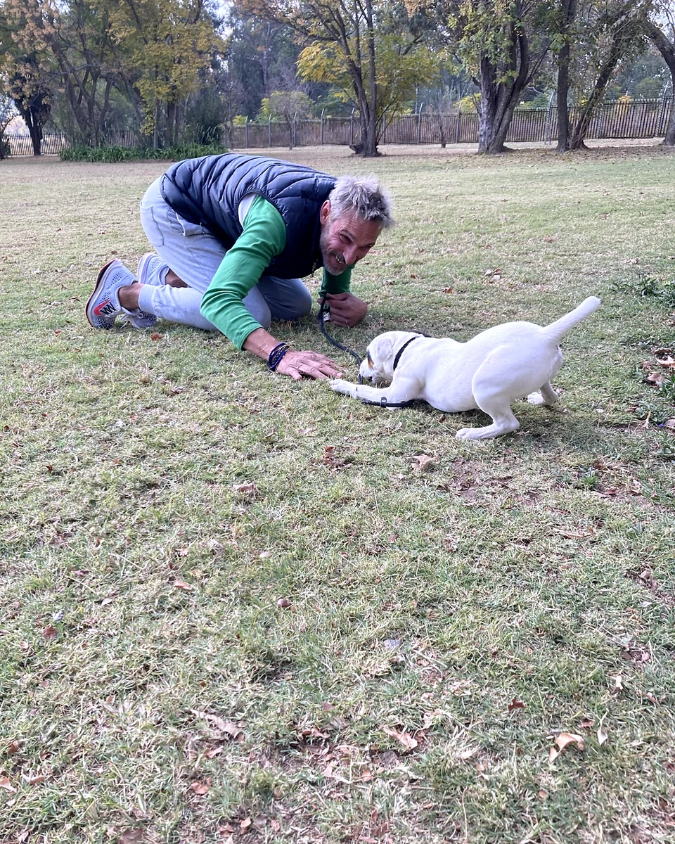 Gareth training a puppy in a home environment